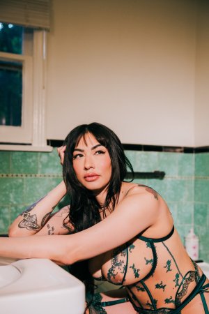 Sabina Magic in emerald lace lingerie on tiled bathroom floor photo 4
