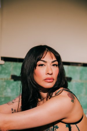 Sabina Magic in emerald lace lingerie on tiled bathroom floor photo 5