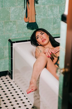 Sabina Magic in emerald lace lingerie on tiled bathroom floor photo 15