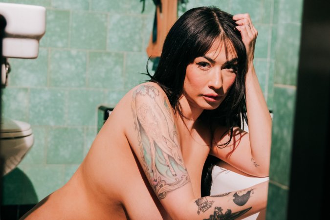 Sabina Magic in emerald lace lingerie on tiled bathroom floor photo 19