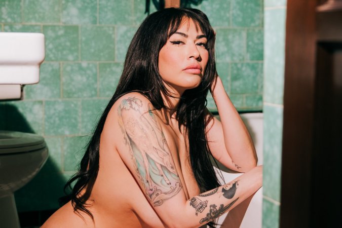Sabina Magic in emerald lace lingerie on tiled bathroom floor photo 21