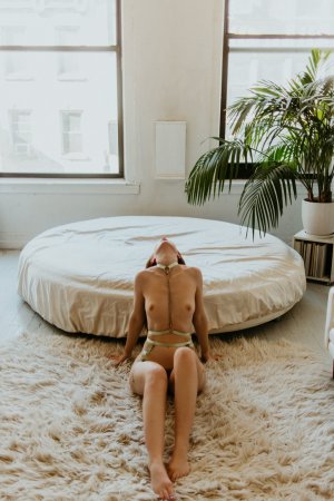 Erin OHara poses in lace harness by window and mirror in bedroom photo 13