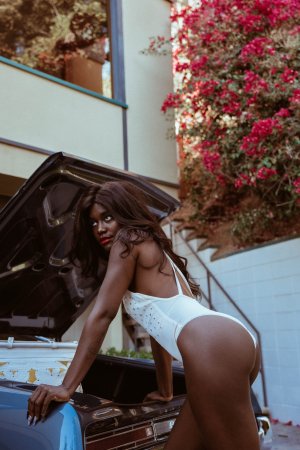 Victoria Antoinette poses in bodysuit and jacket by classic car photo 3