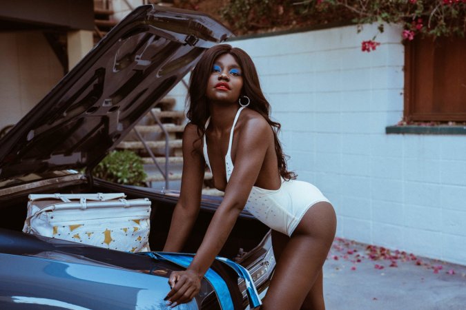 Victoria Antoinette poses in bodysuit and jacket by classic car photo 4