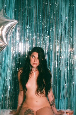 Megan Star in silver sparkle against teal fringe white boots photo 8